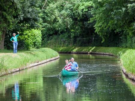 Canoeing together on the water in holiday park Landal Duinpark 't Hof van Haamstede