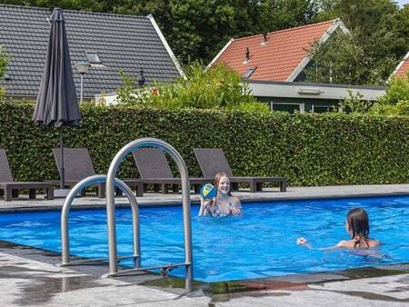 Swimming in the outdoor pool of holiday park Landal Duinpark 't Hof van Haamstede