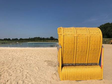 Deck chair on the beach of the Landal Dwergter Sand recreational lake