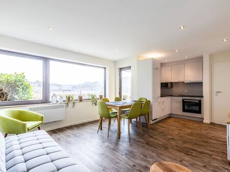 Living room, dining area and kitchen at the Landal Eifel Prümtal . holiday park