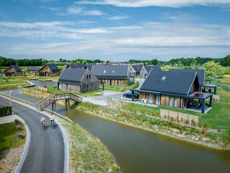 Holiday homes and a bridge over a canal at Landal Elfstedenhart holiday park