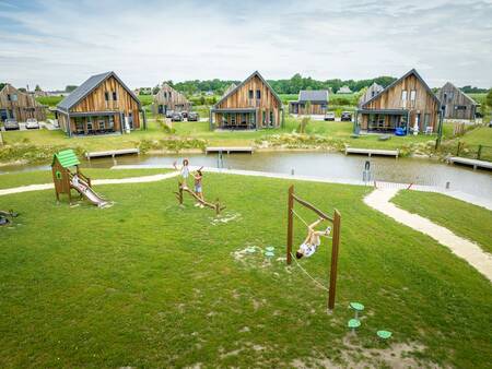 Children play in a playground at Landal Elfstedenhart holiday park