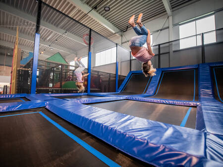 A child on the trampoline in the indoor play paradise of the Landal Esonstad holiday park