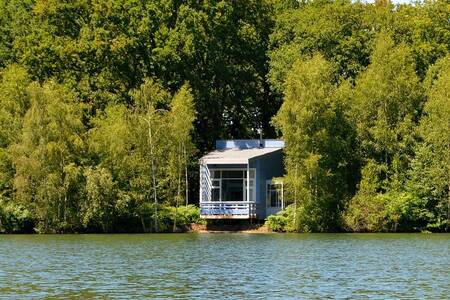 Holiday home with balcony above the water at the Landal Forest Resort Your Nature holiday park
