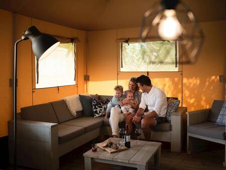 living room in a safari tent at Landal Glamping Neufchâteau holiday park