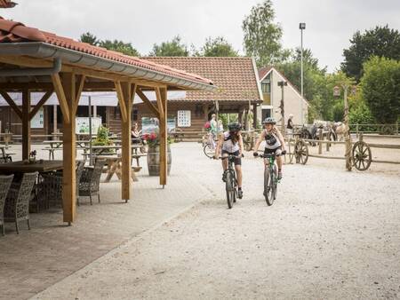 Cycling couple at Landal Het Land van Bartje holiday park