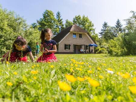 Children in a garden at a holiday home at holiday park Landal Het Land van Bartje