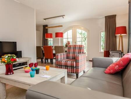 Modern living room of a holiday home at holiday park Landal Het Land van Bartje