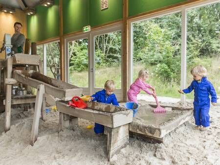 Children play in the indoor playground of holiday park Landal Het Land van Bartje