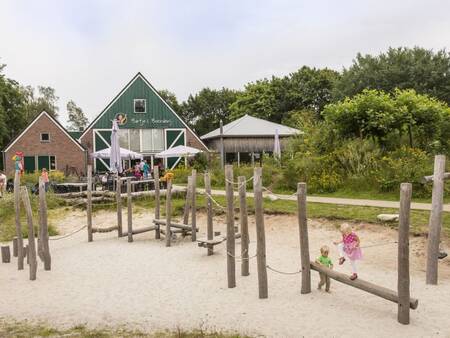 Children play in the playground at Landal Het Land van Bartje holiday park