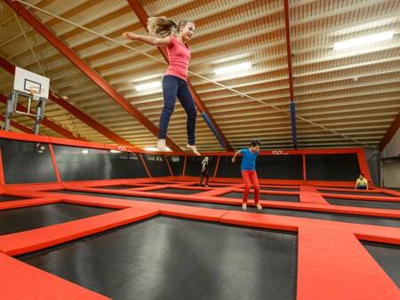 Children jump in the "Bounz Arena" at the Landal Hof van Saksen holiday park