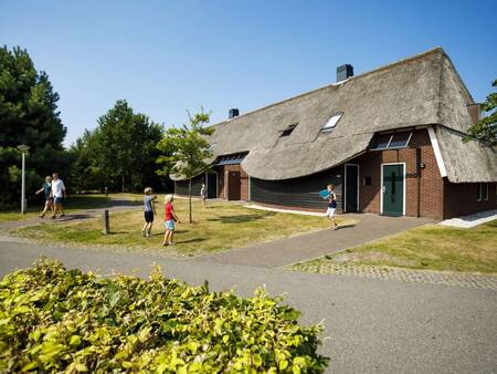 Holiday home with a thatched roof at the Landal Hof van Saksen holiday park