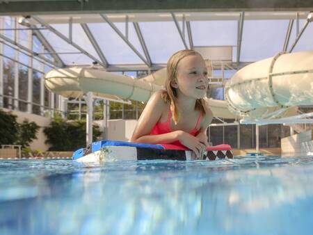 Girl swims in the pool at Landal Holiday Park Søhøjlandet