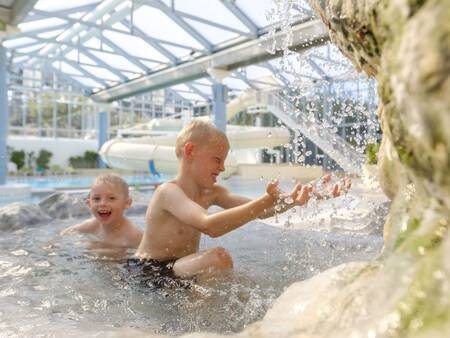 2 children in a hot paddling pool in the swimming pool of Landal Vakantiepark Søhøjlandet