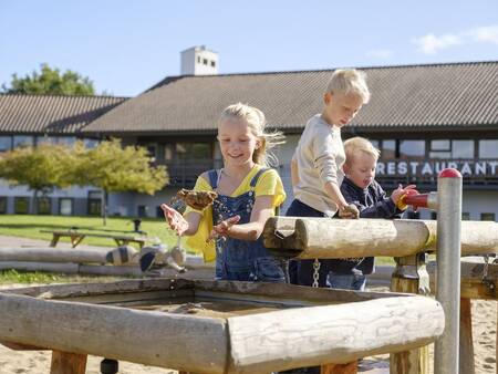 Children play in the water playground at Landal Vakantiepark Søhøjlandet