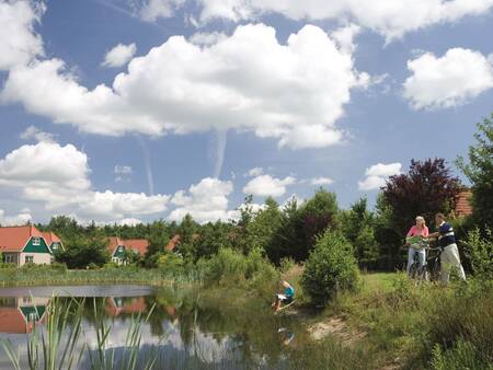 People at the recreational lake of holiday park Landal Hunerwold State