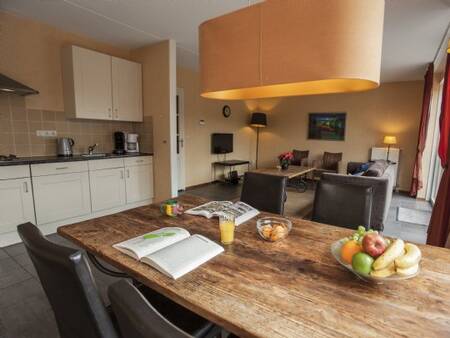 Kitchen with dining area of a villa on holiday park Landal Kasteeldomein De Cauberg