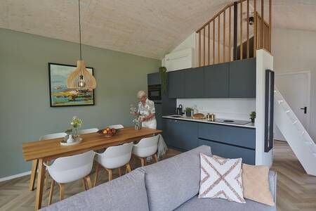 Living room and kitchen of a holiday home at the Landal Klein Oisterwijk holiday park