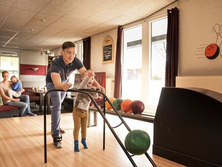 A game of bowling at the bowling alley at the Landal Landgoed Aerwinkel holiday park