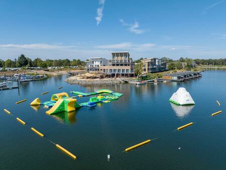 Aerial view with water park and apartment complexes at holiday park Landal Marina Resort Well