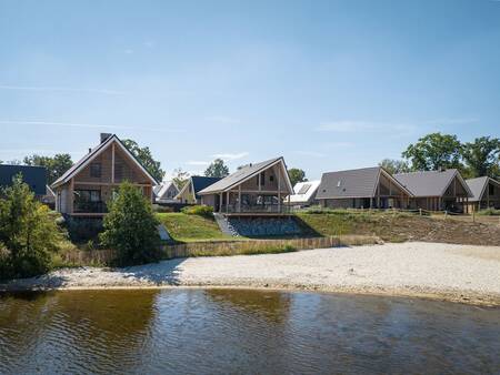 Holiday homes (water houses) and sandy beach at the Landal Marina Resort Well . holiday park