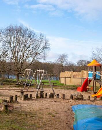 Playground with air trampoline, slide and swings at Landal Middelfart holiday park