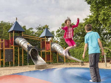 Children jump on the air trampoline in a playground at the Landal Mont Royal holiday park