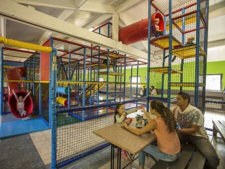 Family in the indoor play paradise of the Landal Mooi Zutendaal holiday park