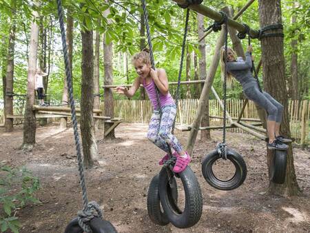 Children play in a playground at Landal Mooi Zutendaal holiday park