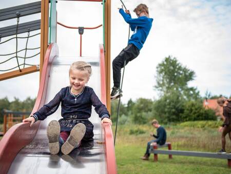 Playground with slide at holiday park Landal Natuurdorp Suyderoogh