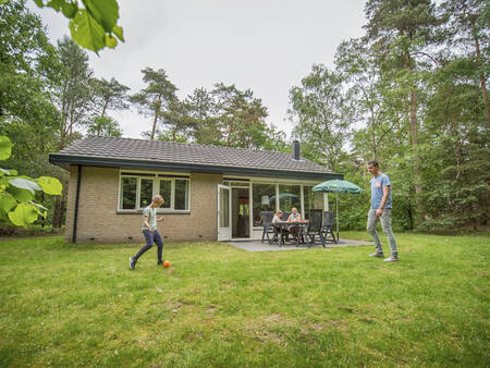 Playing in the garden of a holiday home at the Landal Rabbit Hill holiday park