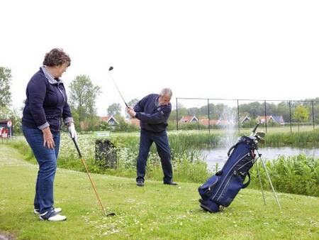 Play a round of golf on the adjacent golf course of holiday park Landal Resort Haamstede