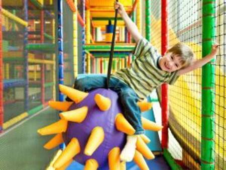 Child plays in the indoor playground at the Landal Salztal Paradies holiday park