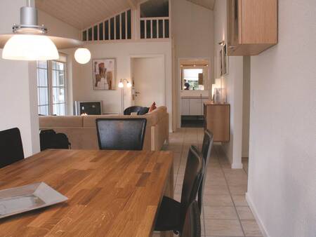 Dining area and living room of a holiday home at Landal Seawest holiday park