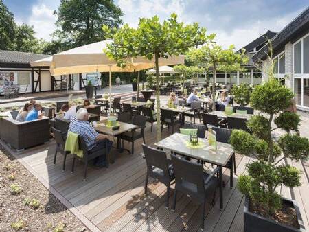 Enjoying the sun on the terrace of the Brasserie at the Landal Sonnenberg holiday park