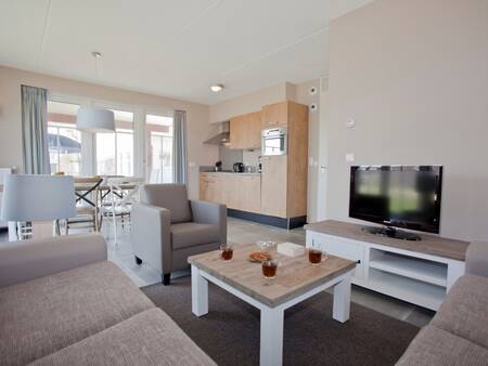 Living room of a holiday home at Landal Strand Resort Nieuwvliet-Bad . holiday park