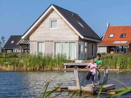 2 children play on a ferry at the Landal Strand Resort Nieuwvliet-Bad holiday park