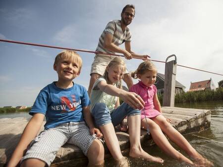 Family on a ferry at holiday park Landal Strand Resort Nieuwvliet-Bad