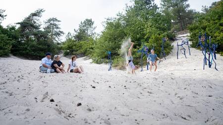Family playing in the Schoorlse Dunes at Landal Holiday Park Duynvallei