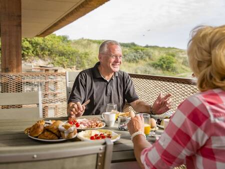 Have breakfast on the balcony of your apartment at Landal Vlieduyn