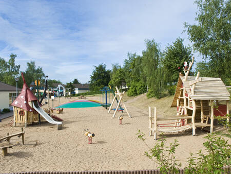 Playground with air trampoline, swings and slides at the Landal Warsberg holiday park