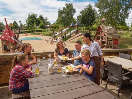 Enjoying the sun on the terrace of Café-Bistro Woods at the Landal Warsberg holiday park
