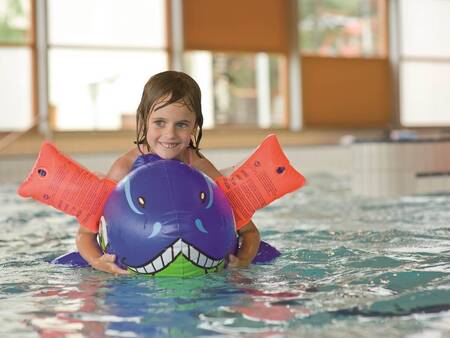 Child swims in Aquaworld Lipno next to holiday park Landal Waterpark Marina Lipno