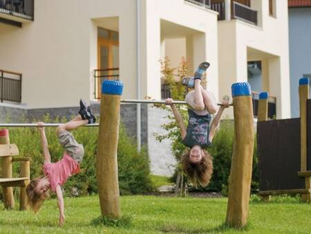 Children play in a playground at the Landal Waterpark Marina Lipno . holiday park