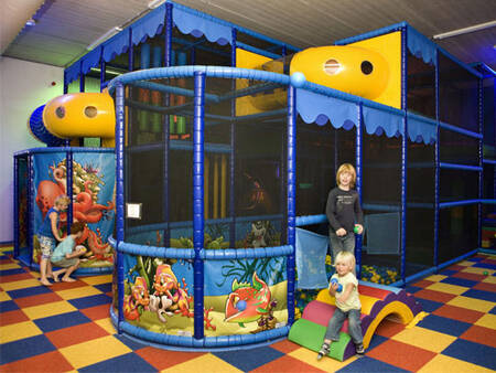 children play in the indoor playground of holiday park Landal Waterparc Veluwemeer