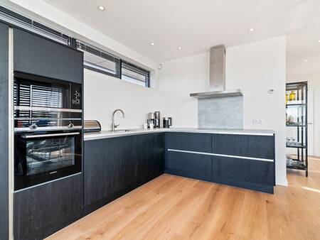 Kitchen of a holiday home at holiday park Landal Waterpark De Alde Feanen