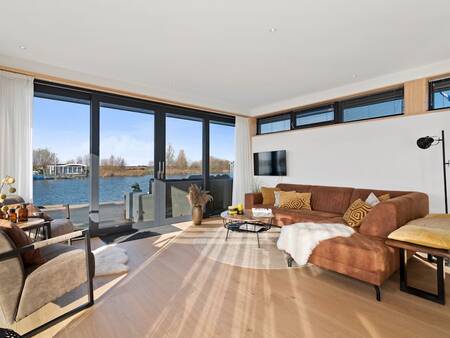 From the living room you have a beautiful view over the water - Landal Waterpark De Alde Feanen