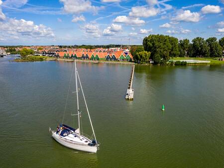 Sailing boat on the Markermeer right in front of the Landal Waterpark Volendam holiday park