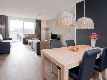 Living room with dining area in an apartment on Landal West-Terschelling