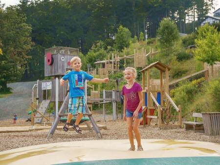 Children jump on the air trampoline in a playground at the Landal Winterberg holiday park